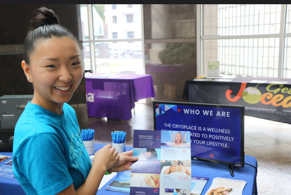 CryoPlace team member welcoming guests at a corporate wellness event